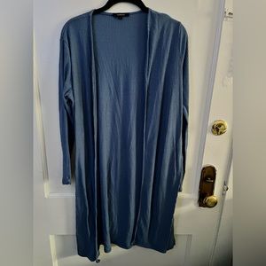Large, long blue cardigan.